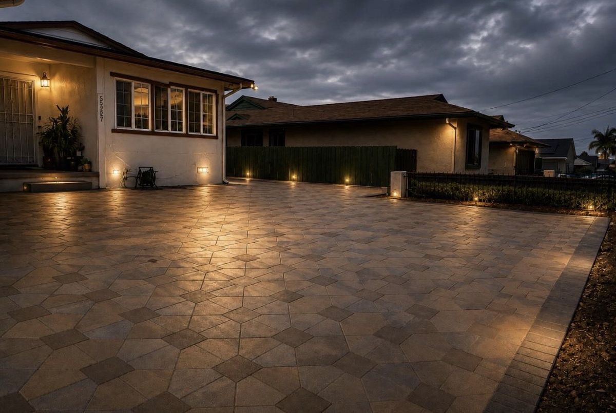 Outdoor courtyard with warm lighting and premium pavers